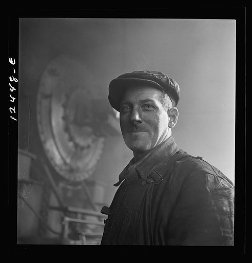 Chicago, Illinois. Worker employed at the roundhouse at a Chicago and Northwestern Railroad yard