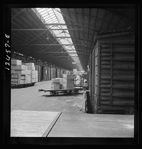 Chicago, Illinois. Goods of every description on loading platforms in a yard waiting to be loaded into cars at the Chicago and Northwestern Railroad freight house