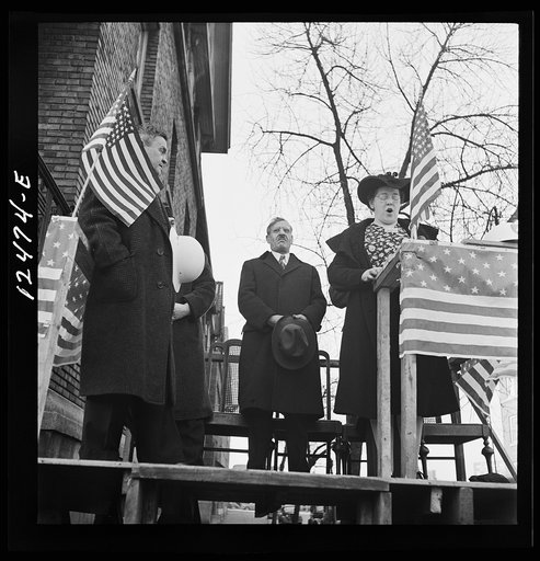 Chicago (north), Illinois. Alice Burns, who sings on a local radio station, leading the singing of the national anthem at a neighborhood flag dedication ceremony