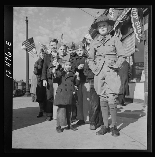 Chicago (north), Illinois. Parade starting at Office of Civilian Defense headquarters, before the dedication of a flag in memory of the men in the armed forces of the block