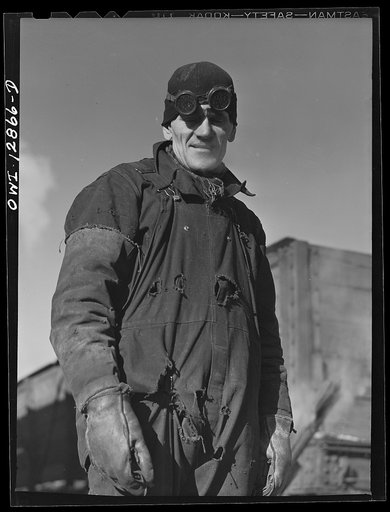 Chicago, Illinois. Worker who is employed at the rip tracks of the Chicago and Northwestern Railroad