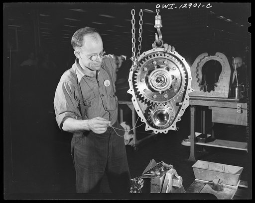 Detroit, Michigan. Assembly of Rolls Royce engines at the Packard motor car company. Complete reduction gear housing assembly