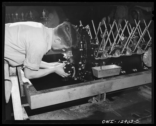 Detroit, Michigan. Assembly of Rolls Royce engines at the Packard motor car company. Assembling the dual drive to the gear housing