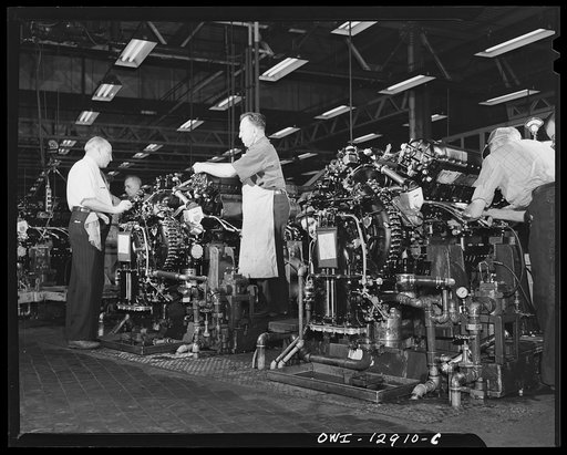 Detroit, Michigan. Assembly of Rolls Royce engines at the Packard motor car company. Flush-in stands