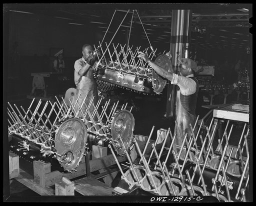 Detroit, Michigan. Assembly of Rolls Royce engines at the Packard motor car company. After cases are washed they are put on racks for assembly