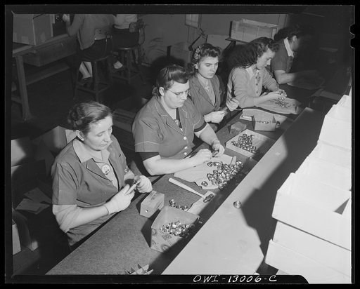 Detroit, Michigan. Assembly of Rolls Royce engines at the Packard Motor Car Company. Checking various dimensions and threads on cylinder hold-down nuts
