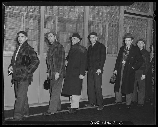 Detroit, Michigan. Assembly of Rolls Royce engines at the Packard Motor Car Company. Going home
