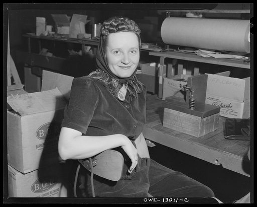 Detroit, Michigan. Assembly of Rolls Royce engines at the Packard Motor Car Company. Waiting for the whistle to blow