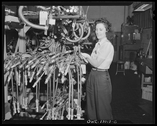 Detroit, Michigan. Assembly of Rolls Royce engines at the Packard Motor Car Company. Visual inspection of ignition wiring harness