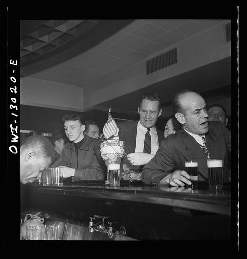 New York, New York. Merchant seamen's Christmas party at the Andrew Feruseth Club on Christmas Day. Drinking beer at the bar