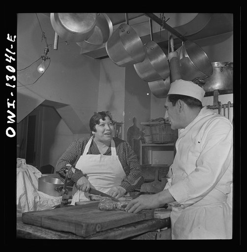 New York, New York. New Year's Eve family party of the Di Costanzo family, owners of Marconi's Restaurant on Mulberry Street. Mamma supervising the cooking of the dinner in the kitchen