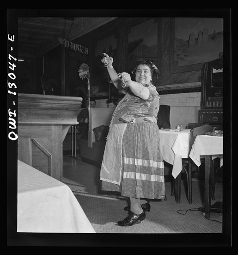 New York, New York. New Year's Eve in Marconi's Restaurant on Mulberry Street. This Gypsy woman is a habitue of the place. She came in for a bite to eat, and put on an extemporaneous dance to entertain the Di Contanzo's family party