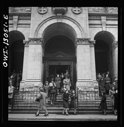 New York, New York. Italian-Americans coming out of Saint Dominick's church on Sullivan Street on New Year's Day