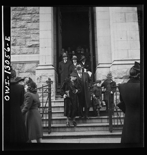 New York, New York. Italian-Americans coming out of Saint Dominick's church on Sullivan street on New Year's day