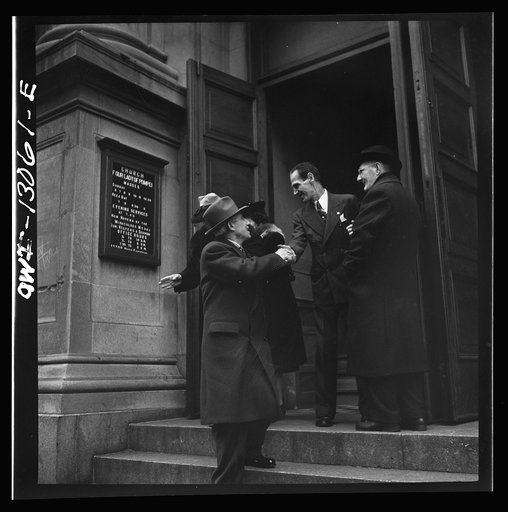 New York, New York. Italian-Americans leaving the church of Our Lady of Pompeii at Bleecker and Carmine Streets, on New Year's Day