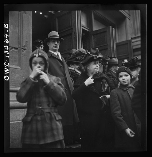 Untitled photo, possibly related to: New York, New York. Italian-Americans leaving the church of Our Lady of Pompeii at Bleecker and Carmine Streets, on New Year's Day