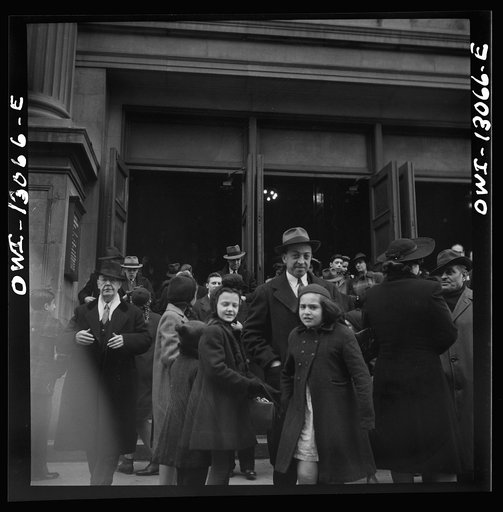 New York, New York. Italian-Americans leaving the church of Our Lady of Pompeii at Bleecker and Carmine Streets, on New Year's Day