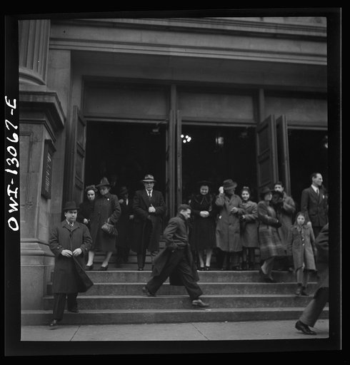 New York, New York. Italian-Americans leaving the church of Our Lady of Pompeii at Bleecker and Carmine Streets, on New Year's Day