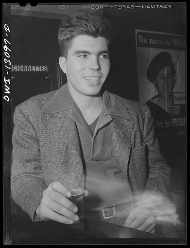 Untitled photo, possibly related to: New York, New York. Merchant seamen's Christmas party at the Andrew Feruseth Club on Christmas Day. Merchant seamen swapping stories. One, (left), had been torpedoed twice