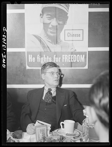 New York, New York. Merchant seamen's Christmas party at the Andrew Feruseth Club on Christmas Day. This serious-minded seaman brought a book along and read part of the time