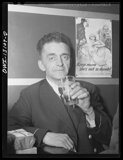 New York, New York. Merchant seamen's Christmas party at the Andrew Feruseth Club on Christmas Day. An old timer, a petty officer, having a beer at the bar. Every seaman got a present; his is still unopened
