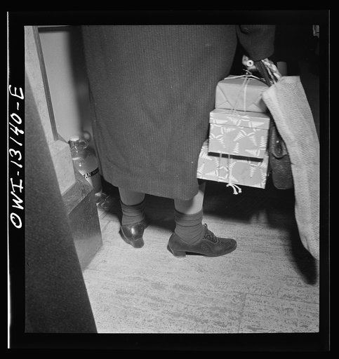 New York, New York. A shopper in R. H. Macy and Company department store during the week before Christmas