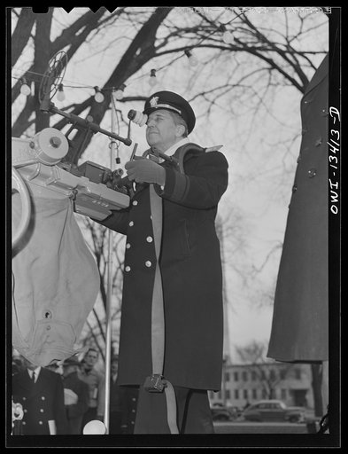 Washington, D.C. Admiral Woodward of the United States Naval Ordnance examining 120 mm gun