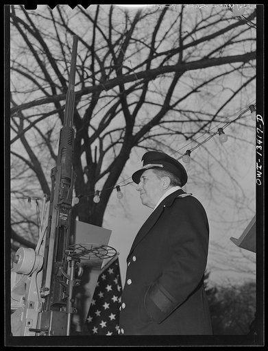 Untitled photo, possibly related to: Washington, D.C. Admiral Woodward of the United States Naval Ordnance addressing crowd gathered to view 120 mm gun