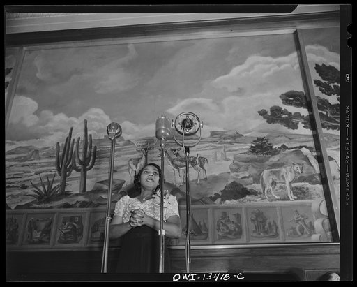 Washington, D.C. Marian Anderson broadcasting a Negro spiritual at the dedication of a mural installed in the United States Department of the Interior building, commemorating the outdoor concert which she gave at the Lincoln Memorial after the Daughters of the American Revolution refused to allow he