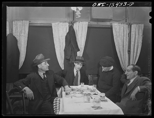 New York, New York. Habitues of a Turkish nightclub on Allen Street drinking beer and eating hors d'oeuvres. Apparently women are left at home
