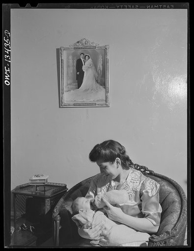 New York, New York. Mrs. Frank Romano and her month-old baby in their apartment on East Fourth Street and Second Avenue. Her husband works in the Brooklyn Navy Yard