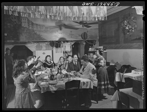 New York, New York. The Di Costanzo family, owners of a restaurant on Mulberry Street, hold their annual family dinner in the restaurant on New Year's Eve. Gypsy friend who comes to eat, dances to entertain them