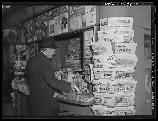 New York, New York. Newsstand at Forty-second Street and Sixth Avenue with newspapers from all nations