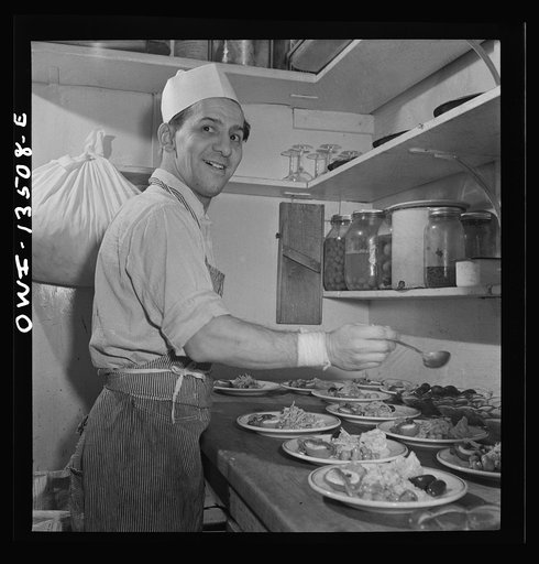 New York, New York. Kitchen worker making antipasto at Sixty-Eight restaurant on Fifth Avenue at Thirteenth Street