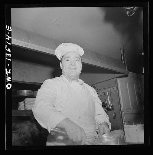 Untitled photo, possibly related to: New York, New York. Chef at the Sixty-Eight restaurant on Fifth Avenue at Thirteenth Street