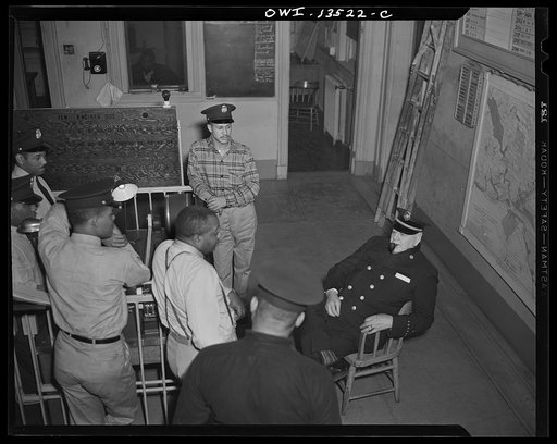 Washington, D.C. Firehouse Station No. 4. The chief of the district visiting the station to find out if any of the men on duty witnessed a soldier making a rescue at a previous fire