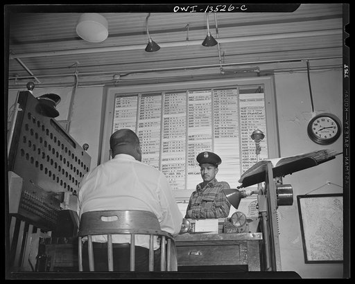 Washington, D.C. Firehouse Station No. 4. Probation fireman being questioned by Lieutenant Mills, to see if he is ready to go before the examination board