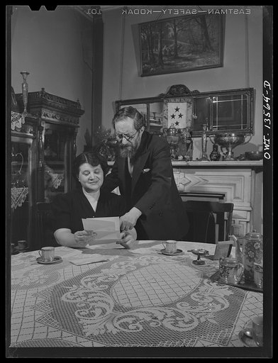 New York, New York. Mr. and Mrs. Raymond [i.e. Raimondo] Fazio reading a letter from their son in the United States Army in Africa. Mr. Fazio is a journalist. They have three other sons in the Army in training in the United States