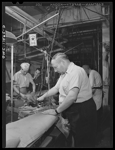 New York, New York. Pressers in the N.M. dress shop which is now making blouses for the Women's Army Auxiliary Corps (WAAC). They are members of local 89 of the International Ladies Garment Workers' Union, predominantly Italian