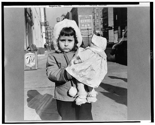 New York, New York. Child on Mott Street on Sunday