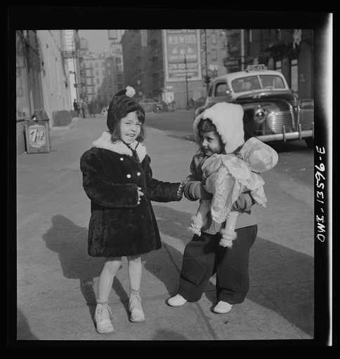 Untitled photo, possibly related to: New York, New York. Child on Mott Street on Sunday