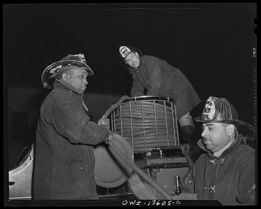 Washington, D.C. Firehouse Station No. 4. Fireman replacing hose after a fire