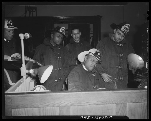 Washington, D.C. Firehouse Station No. 4. Lieutenant Mills making a written report of casualties after returning from a fire
