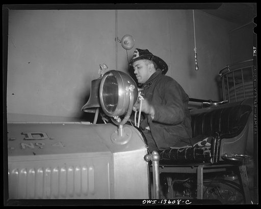 Washington, D.C. Firehouse Station No. 4. Fireman backing in a truck in the station after a fire