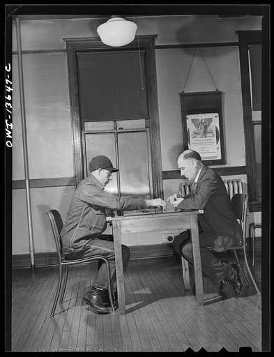 Untitled photo, possibly related to: Gibson, Indiana. A game of checkers at the railroad (YMCA) Young Men's Christian Association