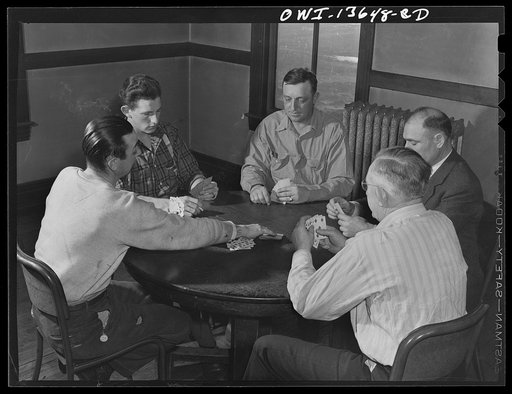 Untitled photo, possibly related to: Gibson, Indiana. A game of cards at the railroad (YMCA) Young Men's Christian Association