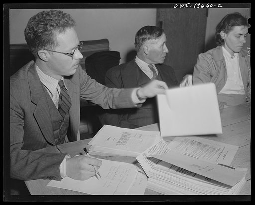 Taos, New Mexico. Jimmy Valentine, secretary of the Taos County cooperative health association, at a board meeting
