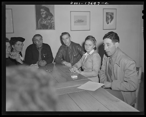 Untitled photo, possibly related to: Taos, New Mexico. Meeting of the Board of Directors of the Taos County cooperative health association. Secretary; four Spanish-Americans representing the different regions: Father Cassidy from Penasco; a nurse from Questa; a nurse from Penasco; Father Smith from 