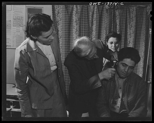 Penasco, New Mexico. An ear examination at the clinic operated by the Taos County cooperative health association