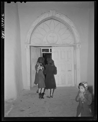 Untitled photo, possibly related to: Ranchos de Taos, New Mexico. At the doorway into the church